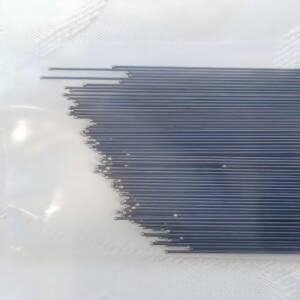 Close-up of nitinol mandrel and wire spool on factory table.